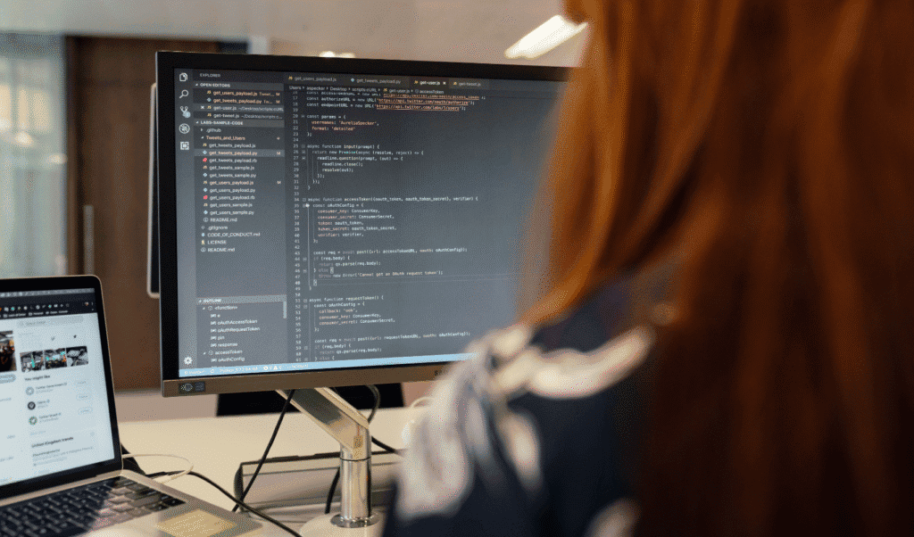 Developer working on data integration code for enterprise DaaS platform implementation