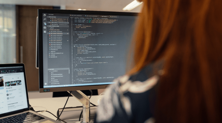 Developer working on data integration code for enterprise DaaS platform implementation