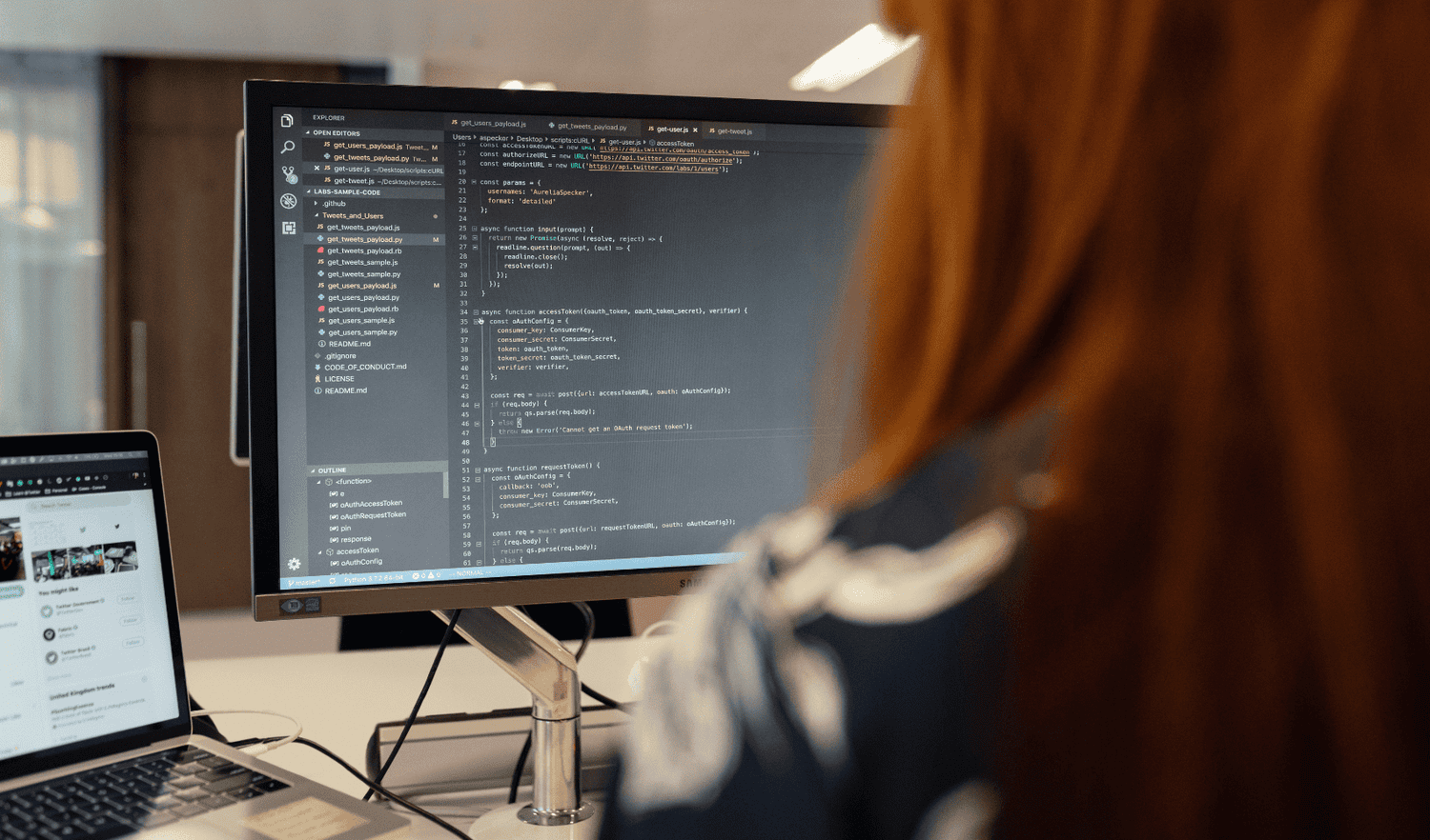 Developer working on data integration code for enterprise DaaS platform implementation