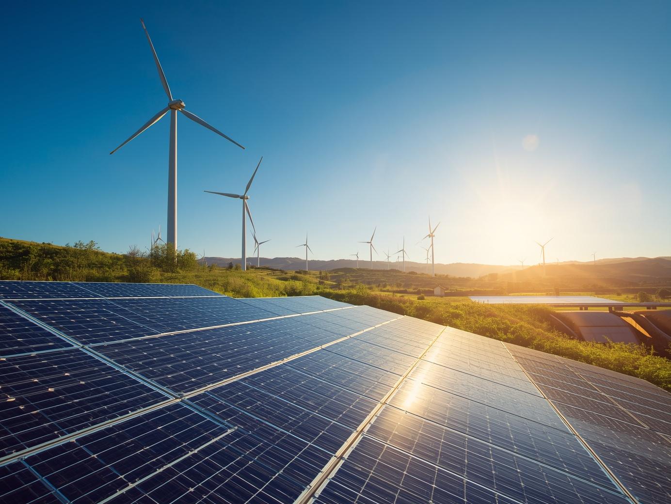 Wind turbines and solar panels generating renewable electricity in Europe linked to green certificates
